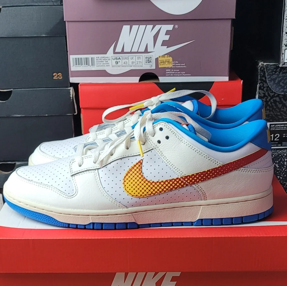Nike White and Blue Sneakers with Orange Swoosh